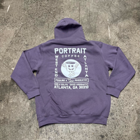 A purple hooded sweatshirt with text and graphics printed on the back, including the words 'PORTRAIT' and 'ATLANTA, GA'.