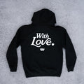 Black hoodie with 'With Love' text on a gray surface